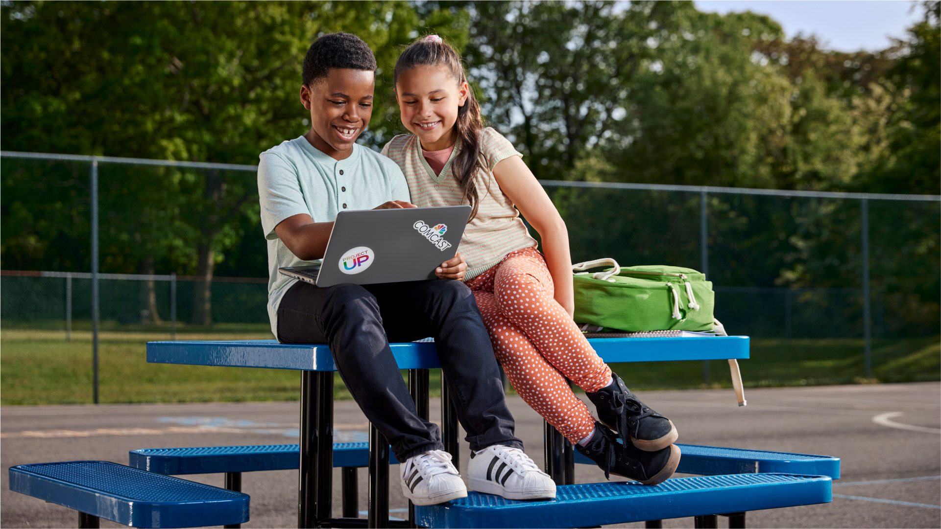 Students using a laptop.