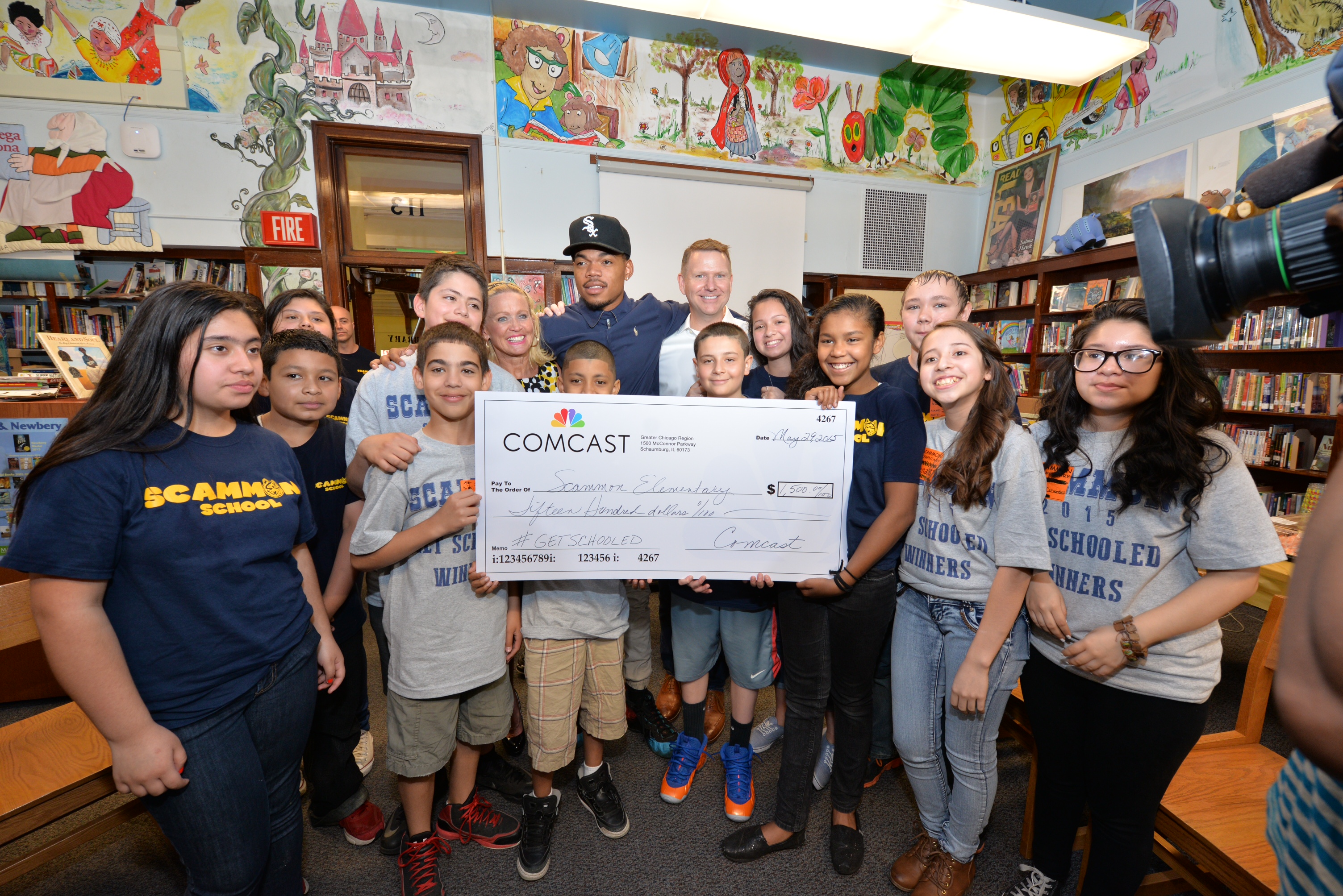 Chance the Rapper joins Comcast's Joe Higgins to recognize  Chicago's Scammon Elementary for tying for first place in the "Get Schooled, Get Connected" Spring Challenge.