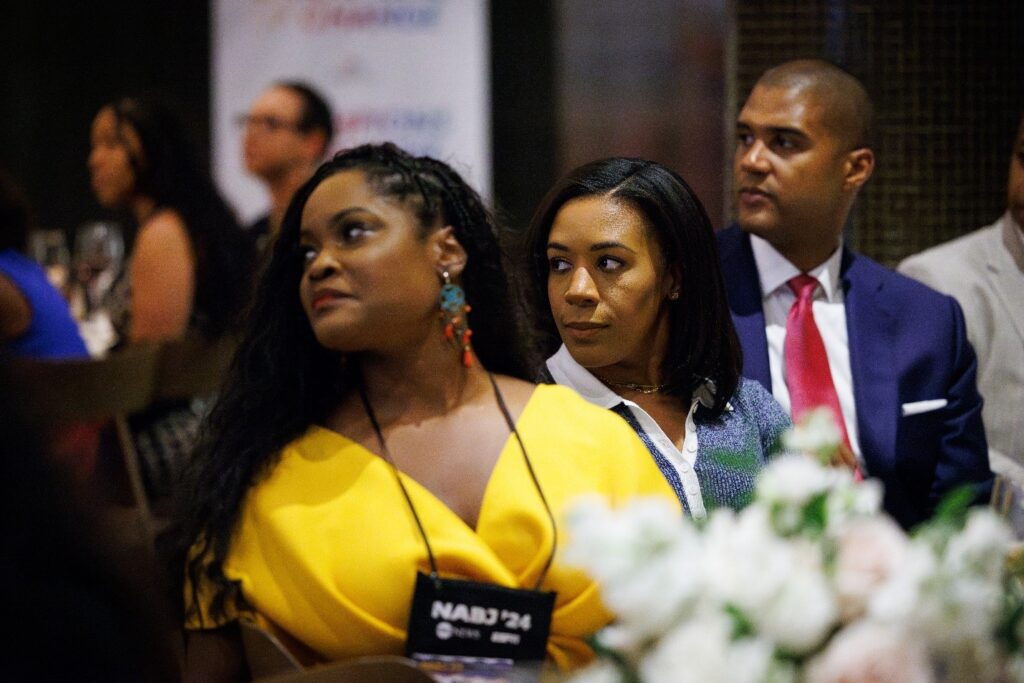 Prominent journalists and content creators listen to opening remarks at the Comcast Champions of Change event in Chicago. 