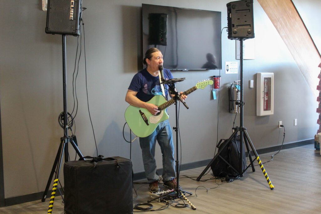 Musician playing at the ribbon cutting and grand opening celebration for the Boys & Girls Clubs of Weld County's new Teen Center.