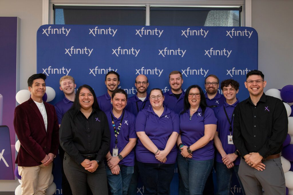 Xfinity Store employees posing for a picture.