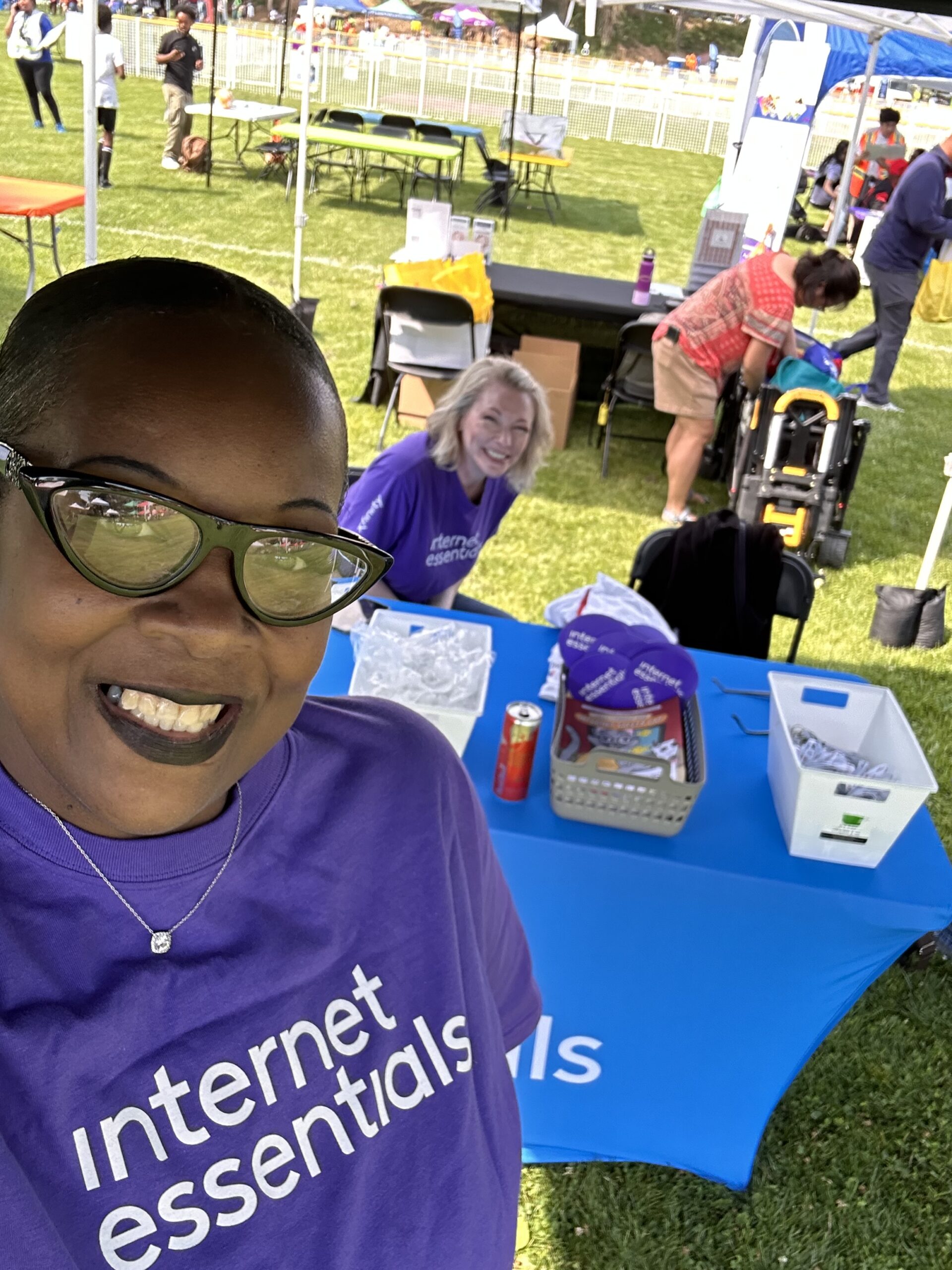 Comcast volunteers at an Internet Essentials table.