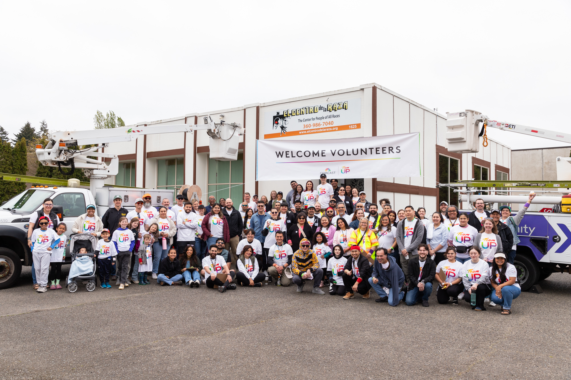 Comcast employee volunteers in front of El Centro de la Raza in Federal Way.