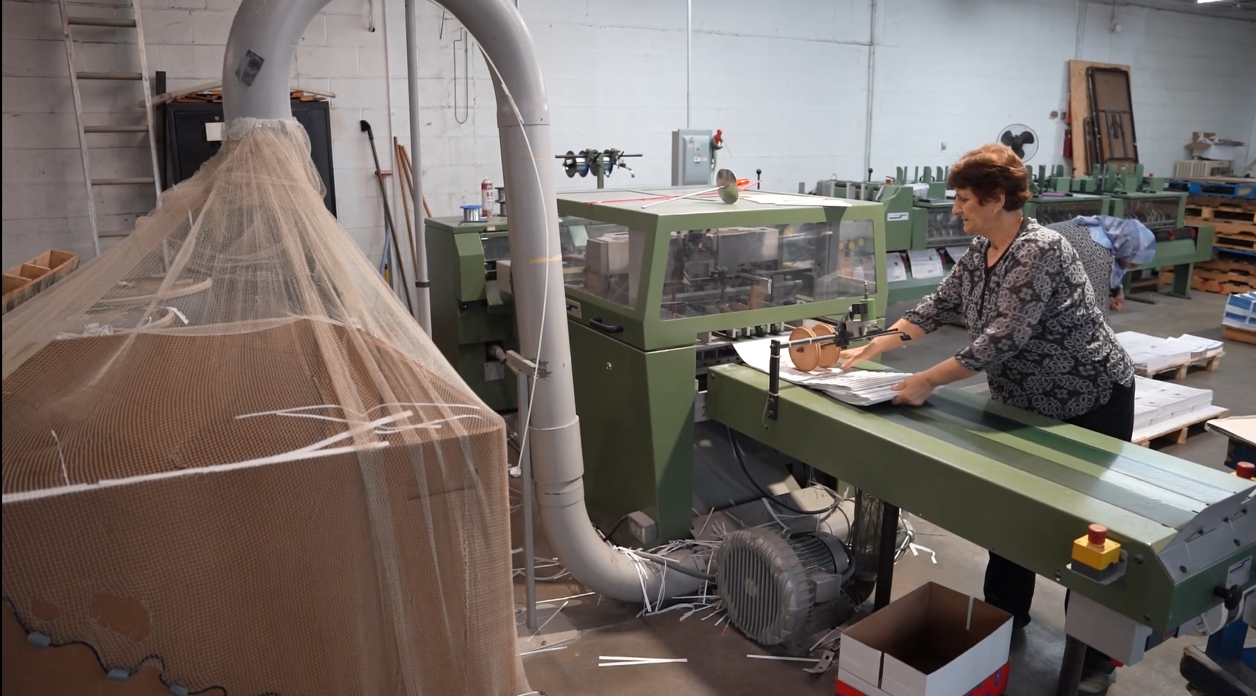 Woman working on printing press