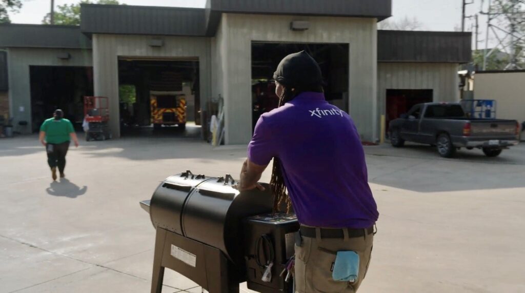 An Xfinity technician wheels in a new grill for firefights.