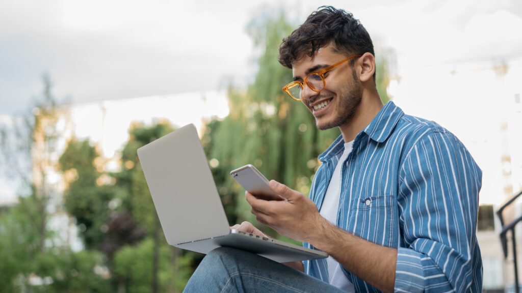 College student enjoying Xfinity's fast internet network while saving money.