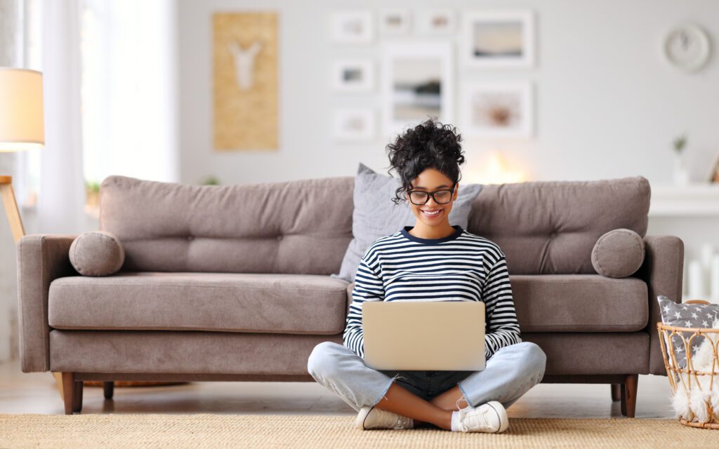 Cheerful student watching her favorite shows through StreamSaver on the Xfinity network.