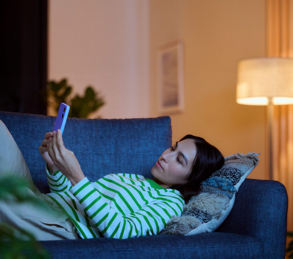 College student enjoying Xfinity's fast internet network while saving money.