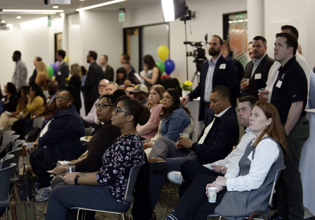 Attendees are seen in the crowd during the Comcast RISE kickoff event