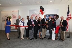 Comcast SVP Doug Guthrie (fourth from right) welcomes local elected officials in a ribbon-cutting ceremony at the Alpharetta grand opening.