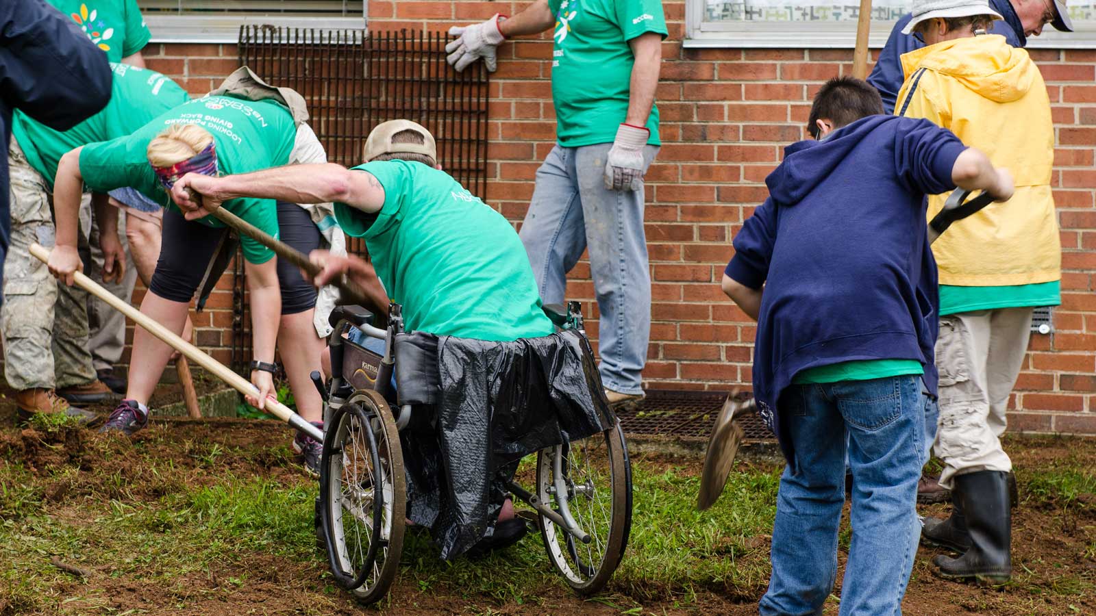 Comcast Cares Day volunteers gardening