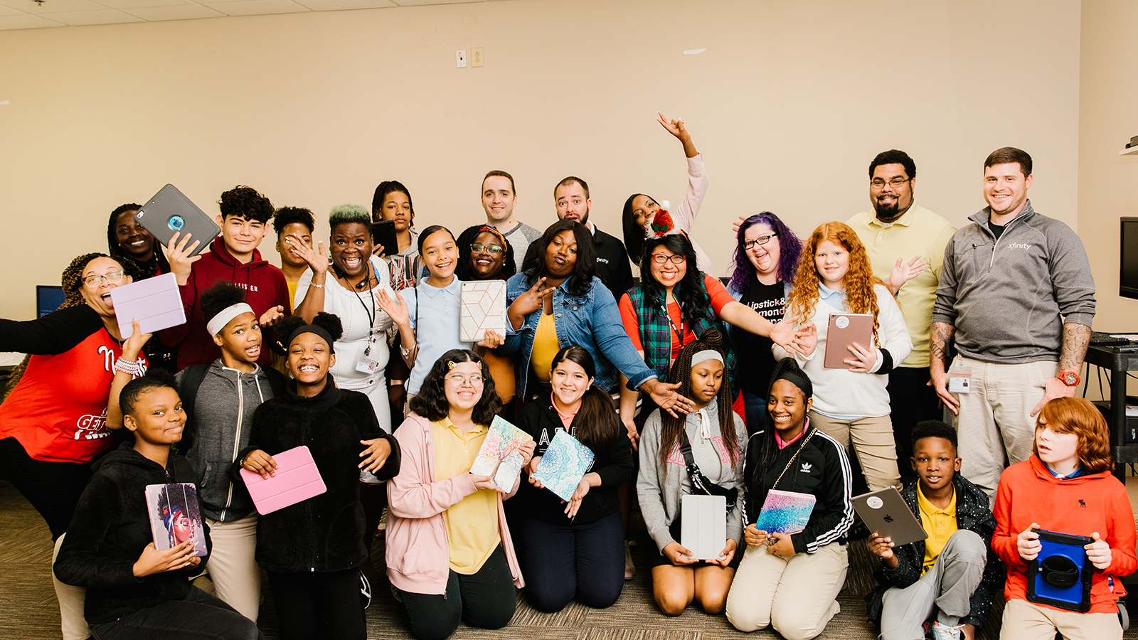 Students from Jere Baxter Middle School receive free devices at an Beyond School Walls event.