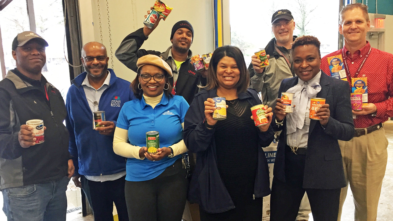 Comcast employees donating their time at a Food Drive