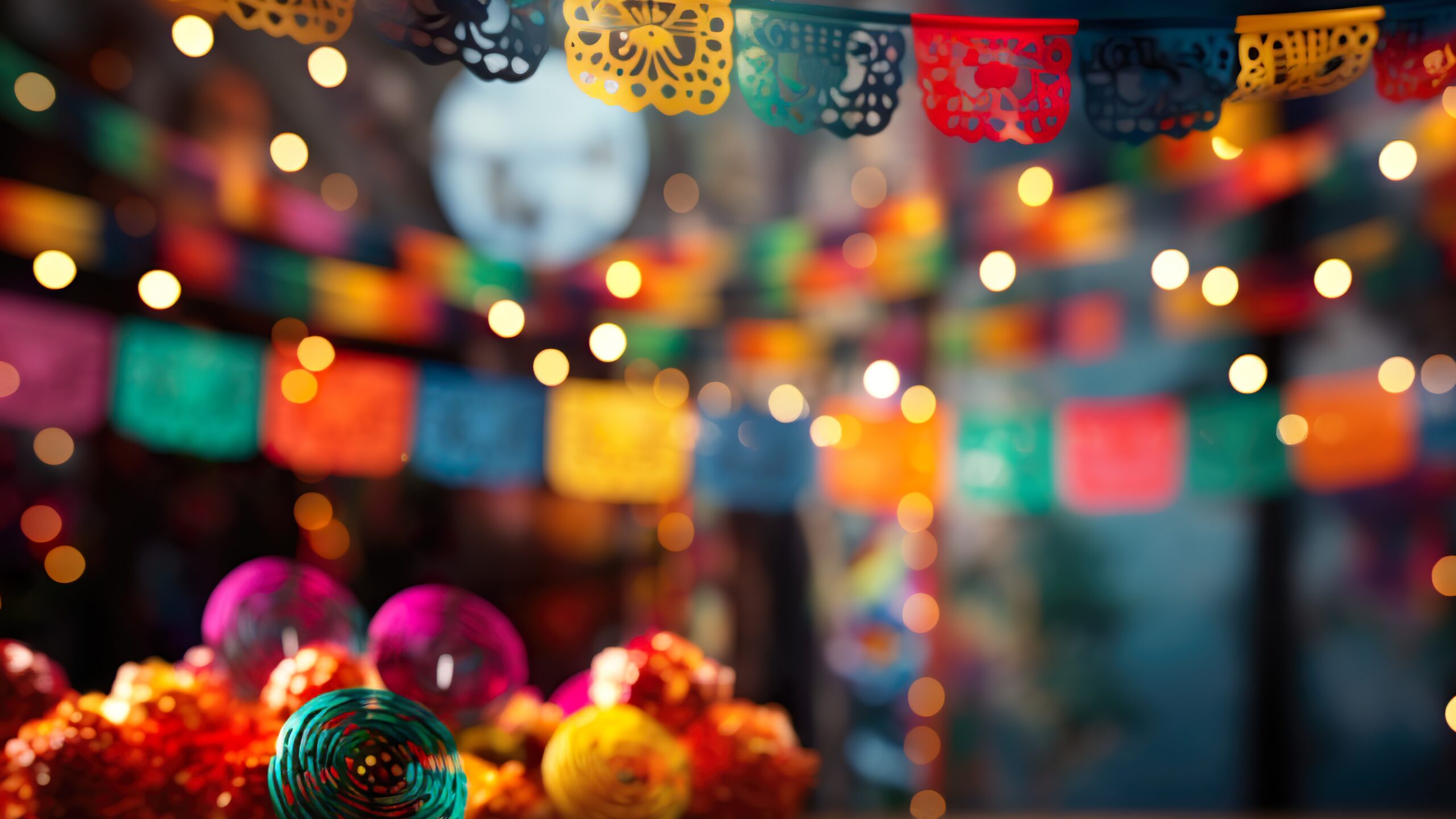 Empty table with Mexican fiesta decorations with out of focus background,
