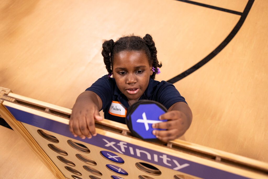 Student playing connect 4 