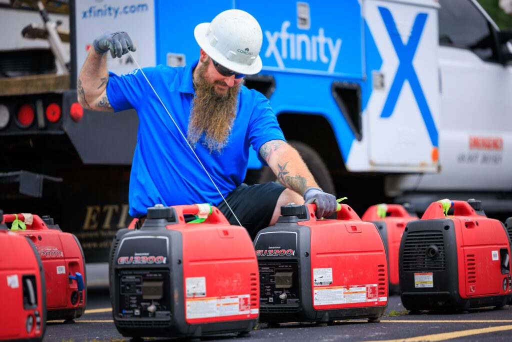 man prepping generators for storm response