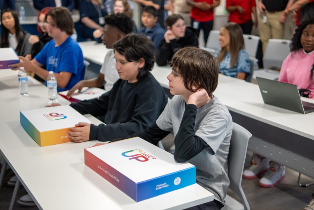 Students and families receiving a laptop donation from Comcast in South Carolina.