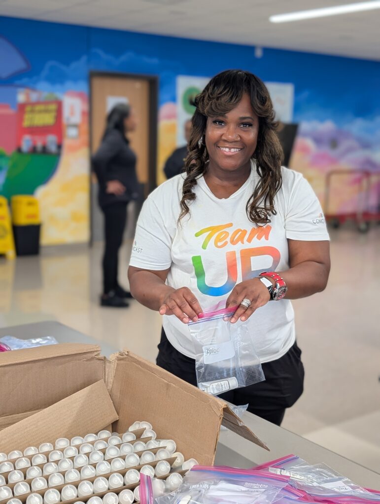 Shante packages up items at a Team UP event