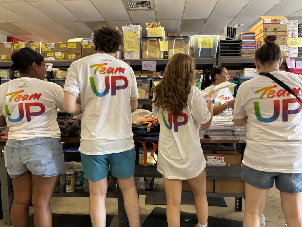 volunteers packing backpacks