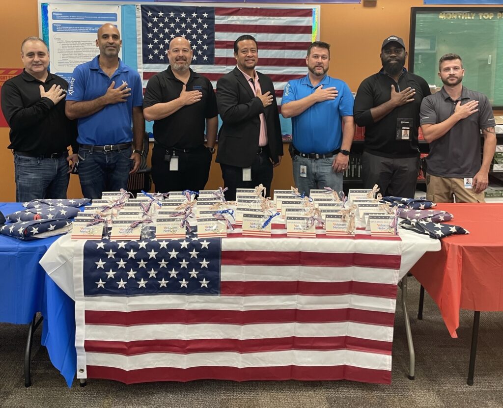 Seven men honor the American Flag