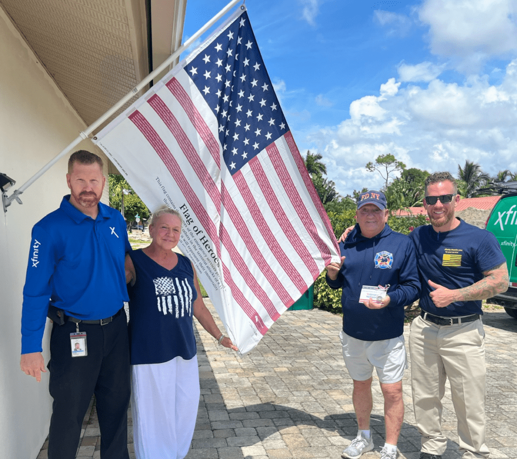 People posing with the American flag