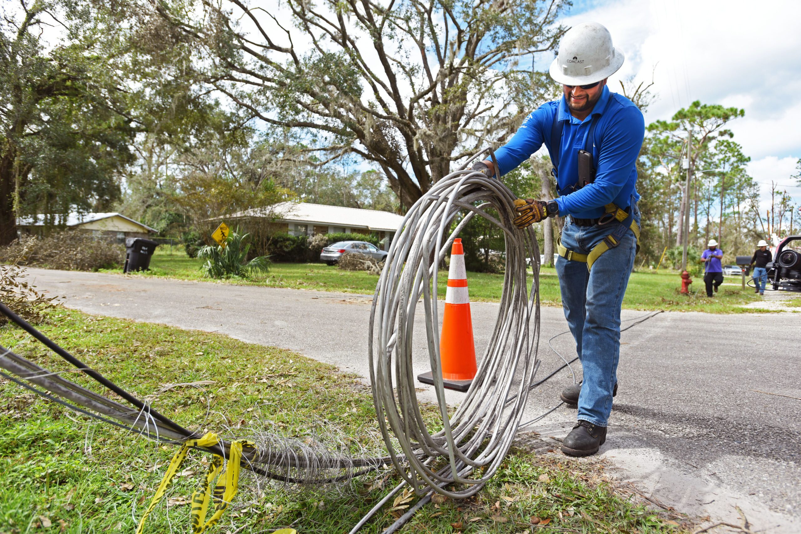 An Xfinity technician lays a new line to restore connectivity in Perry, Fla. on Monday, Sept. 30, 2024 following the destruction caused by Hurricane Helene.