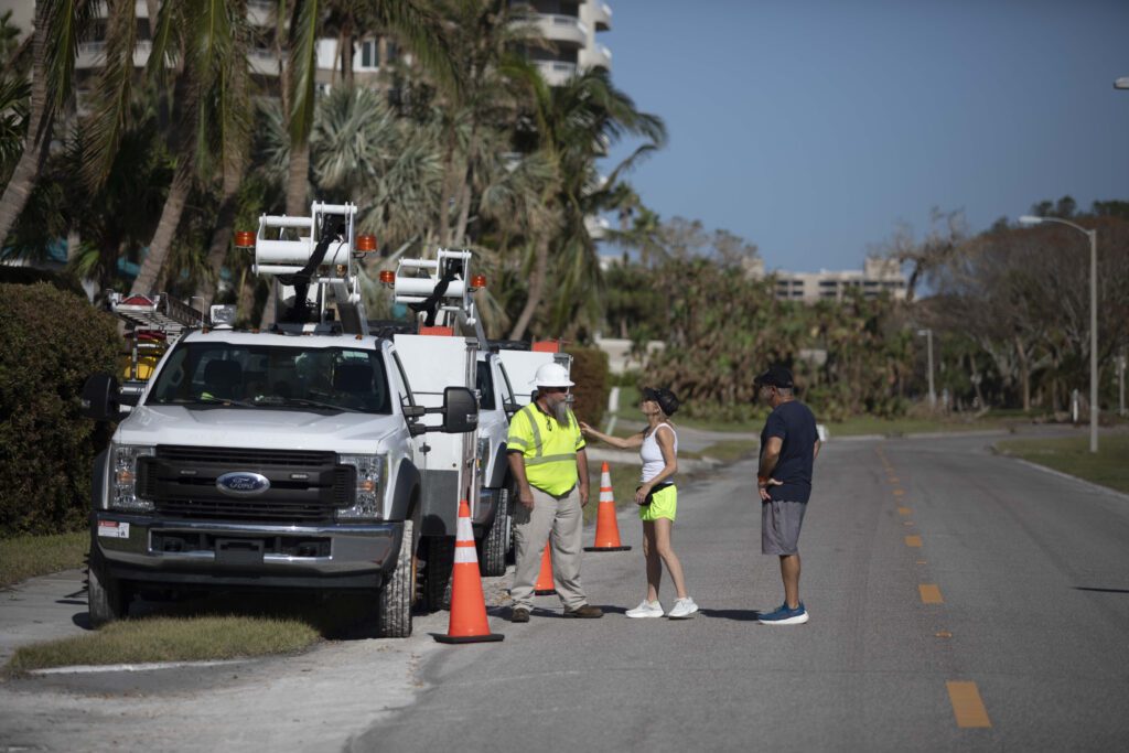 Local residents thank an Xfinity technician for his work to restore internet.