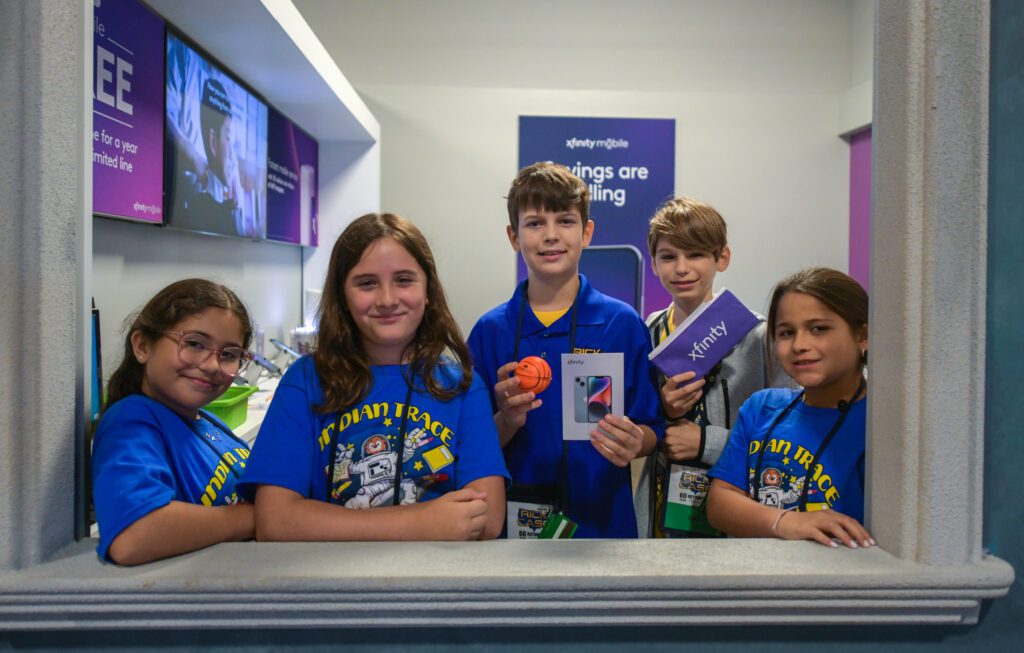 Students pose for a photo at the Xfinity Store in JA Biztown.