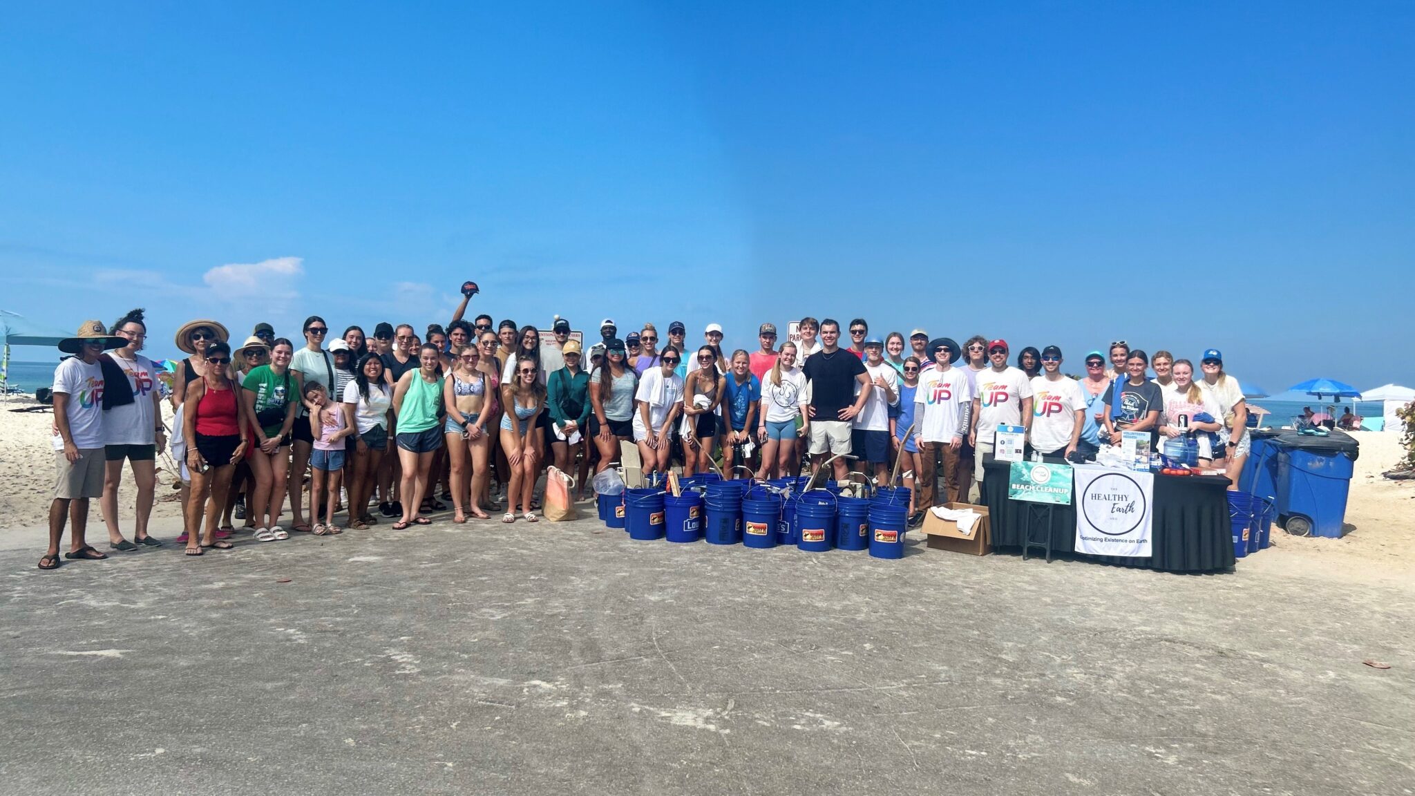 people cleaning a beach