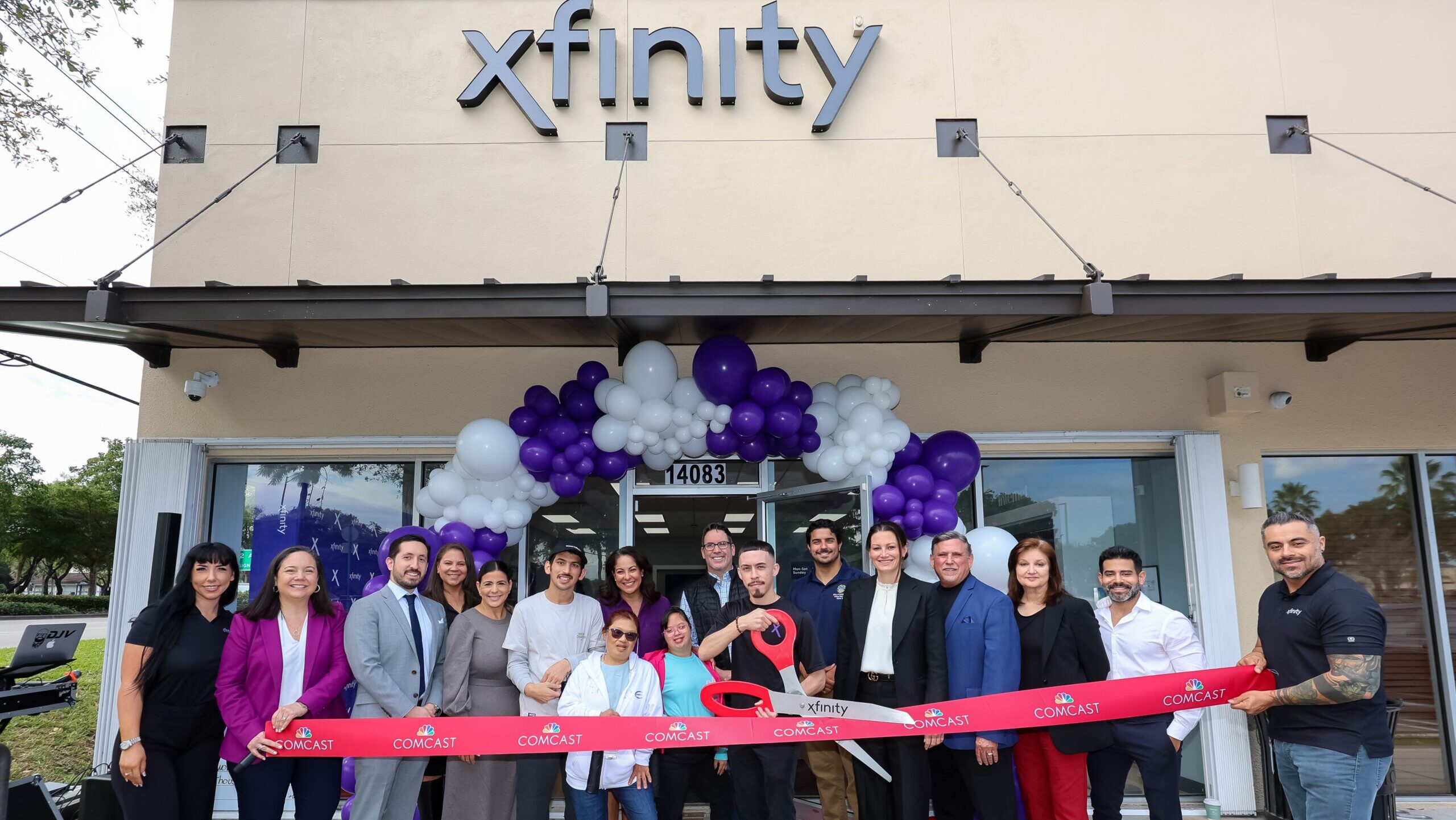 people at a ribbon cutting ceremony