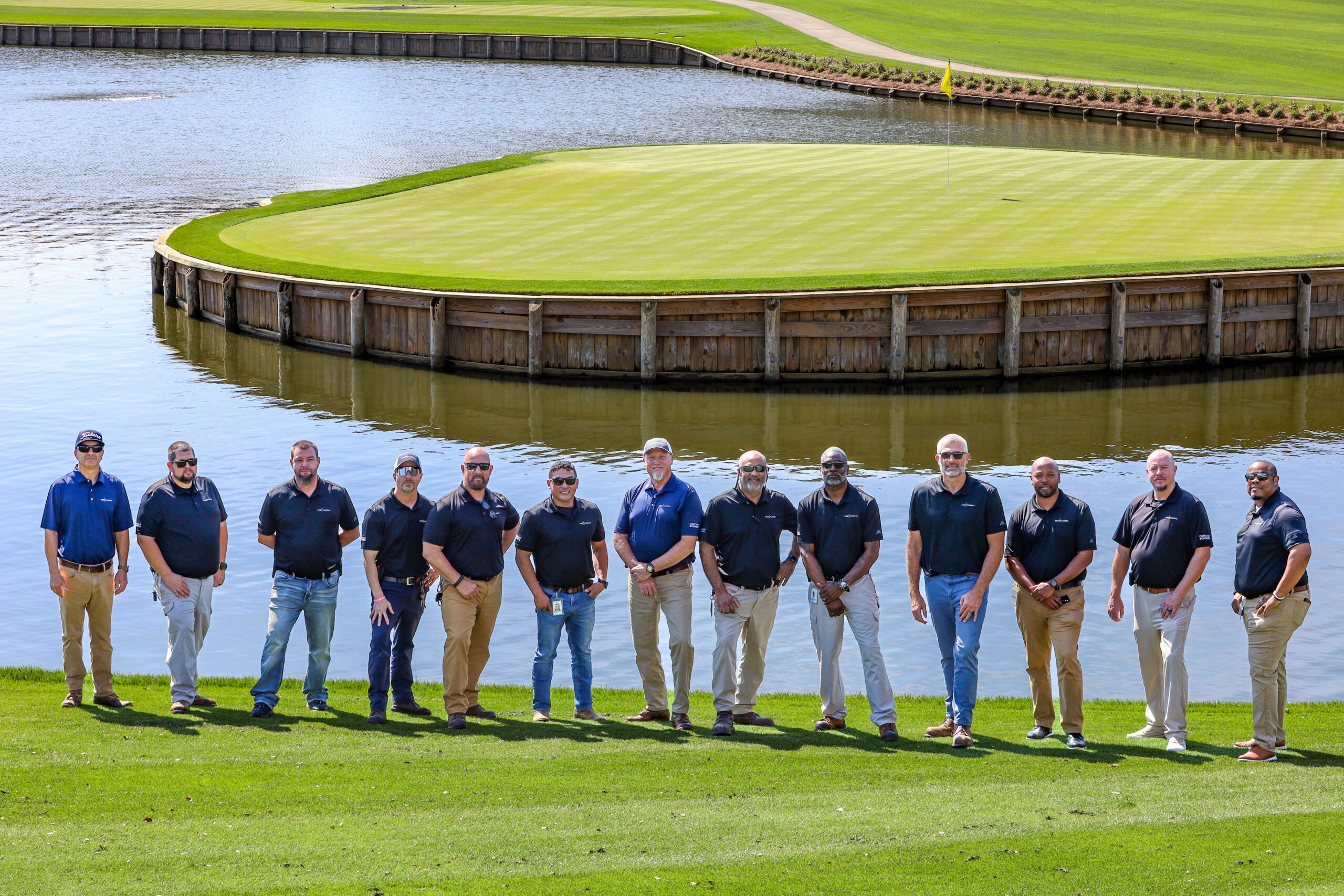 Comcast Business team poses at TPC Sawgrass