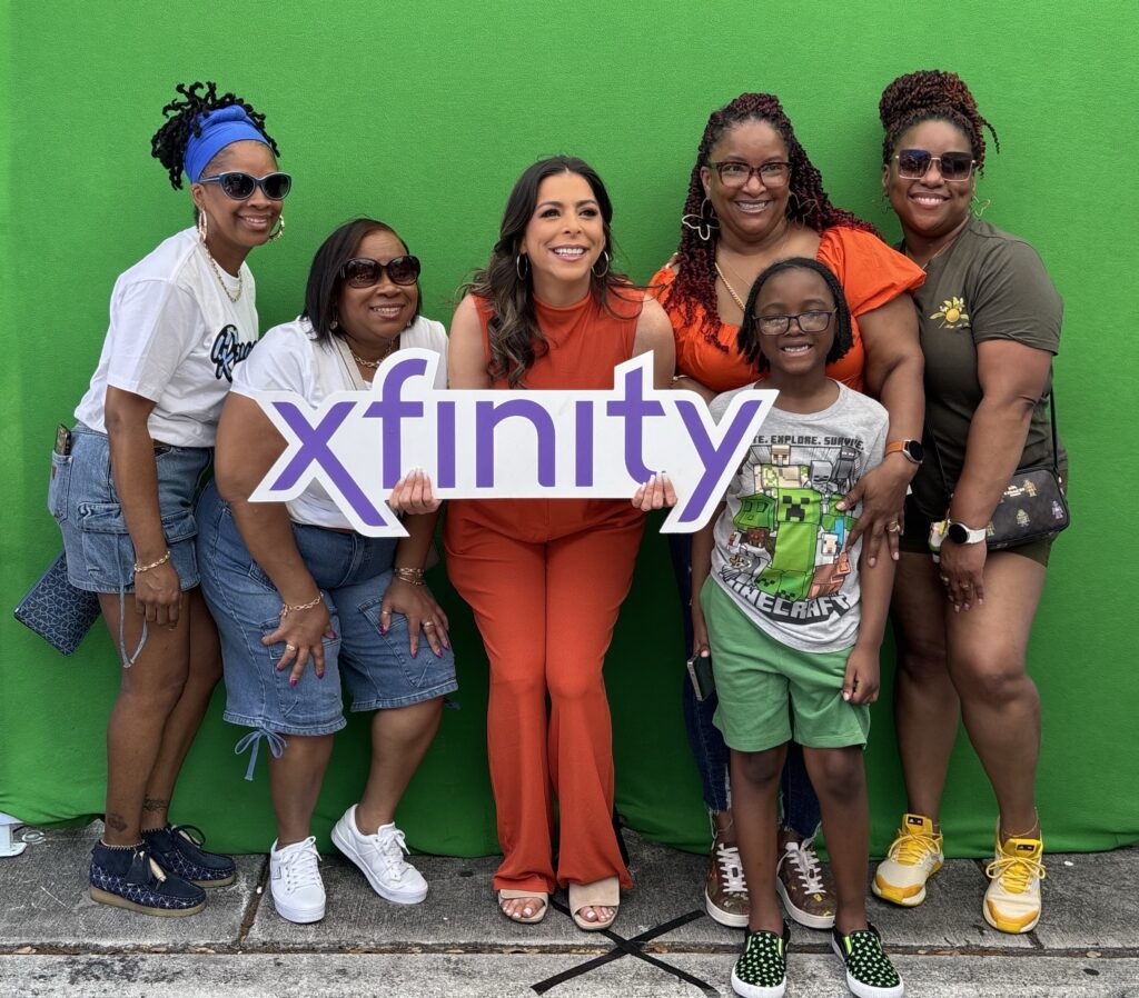 people pose for a picture with a celebrity