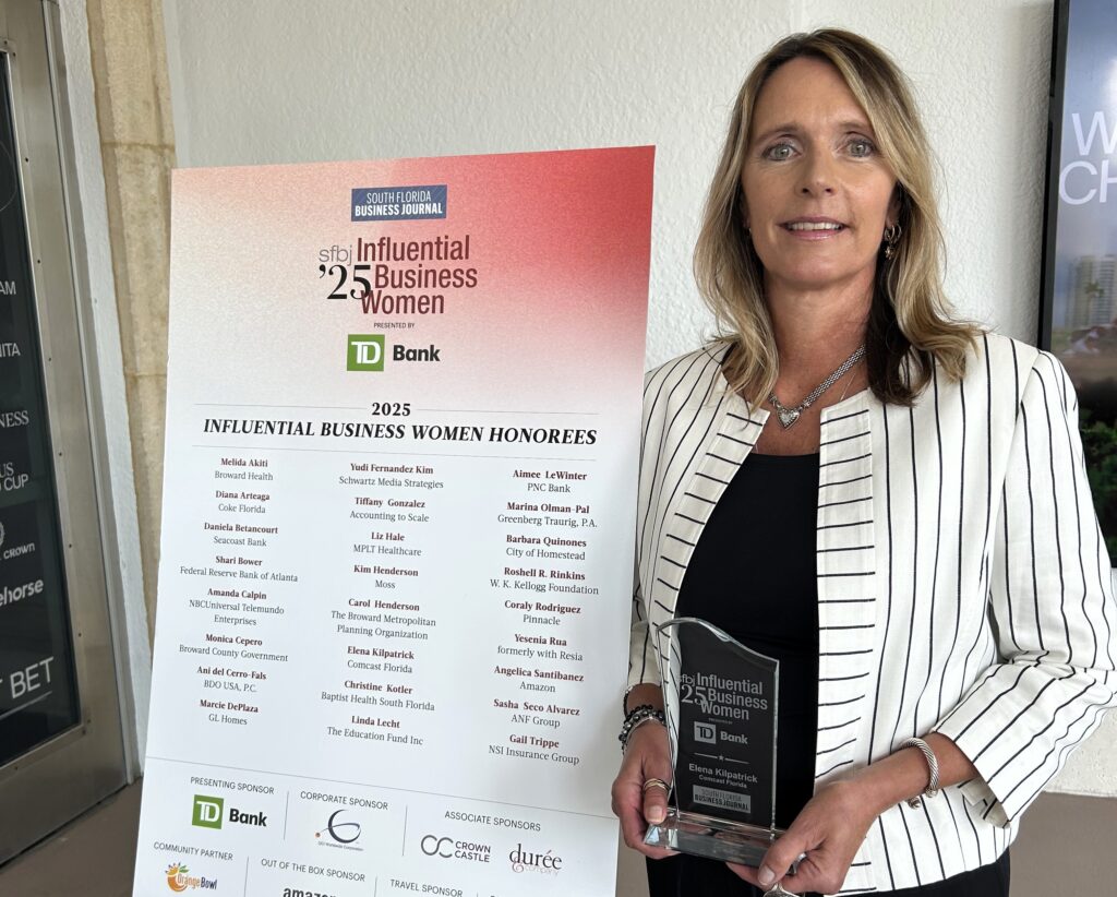 Kilpatrick poses with her Influential Business Women award.