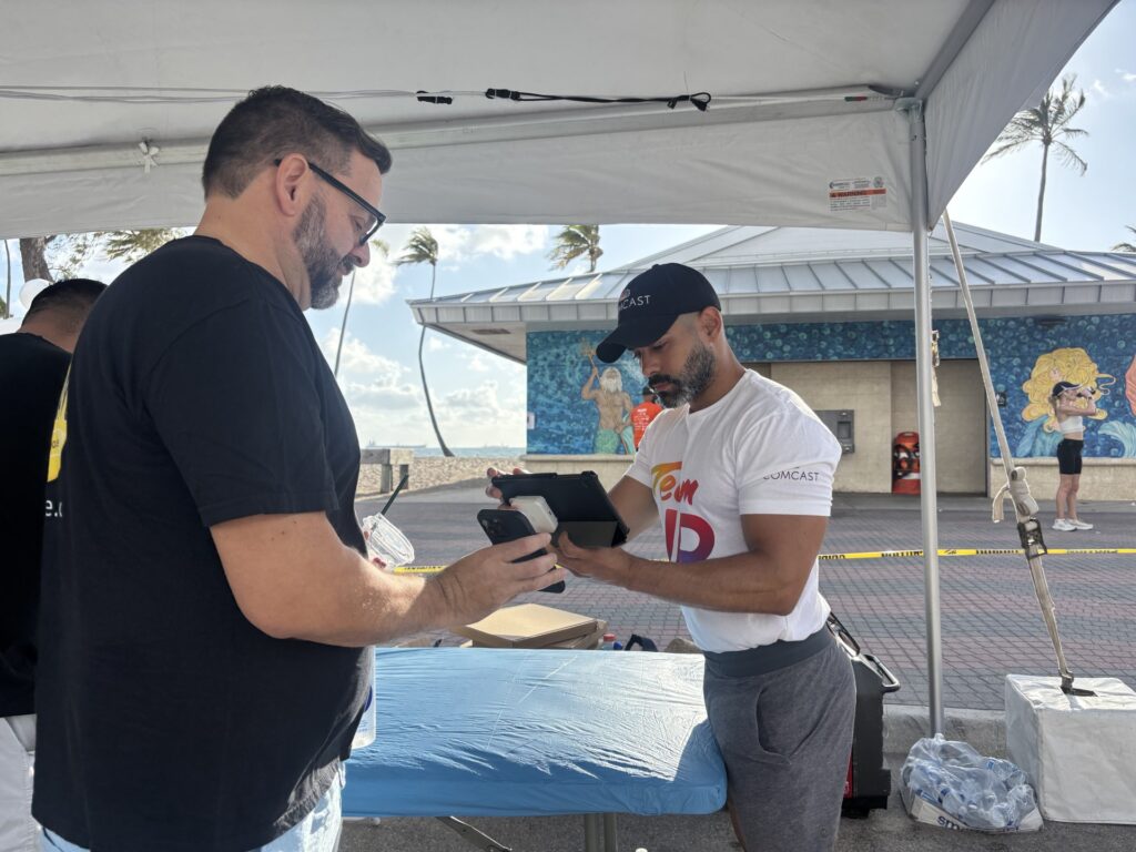 man registering a man at an event