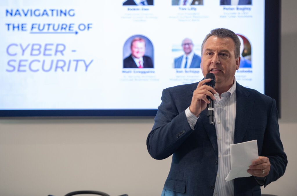 man speaking to a microphone