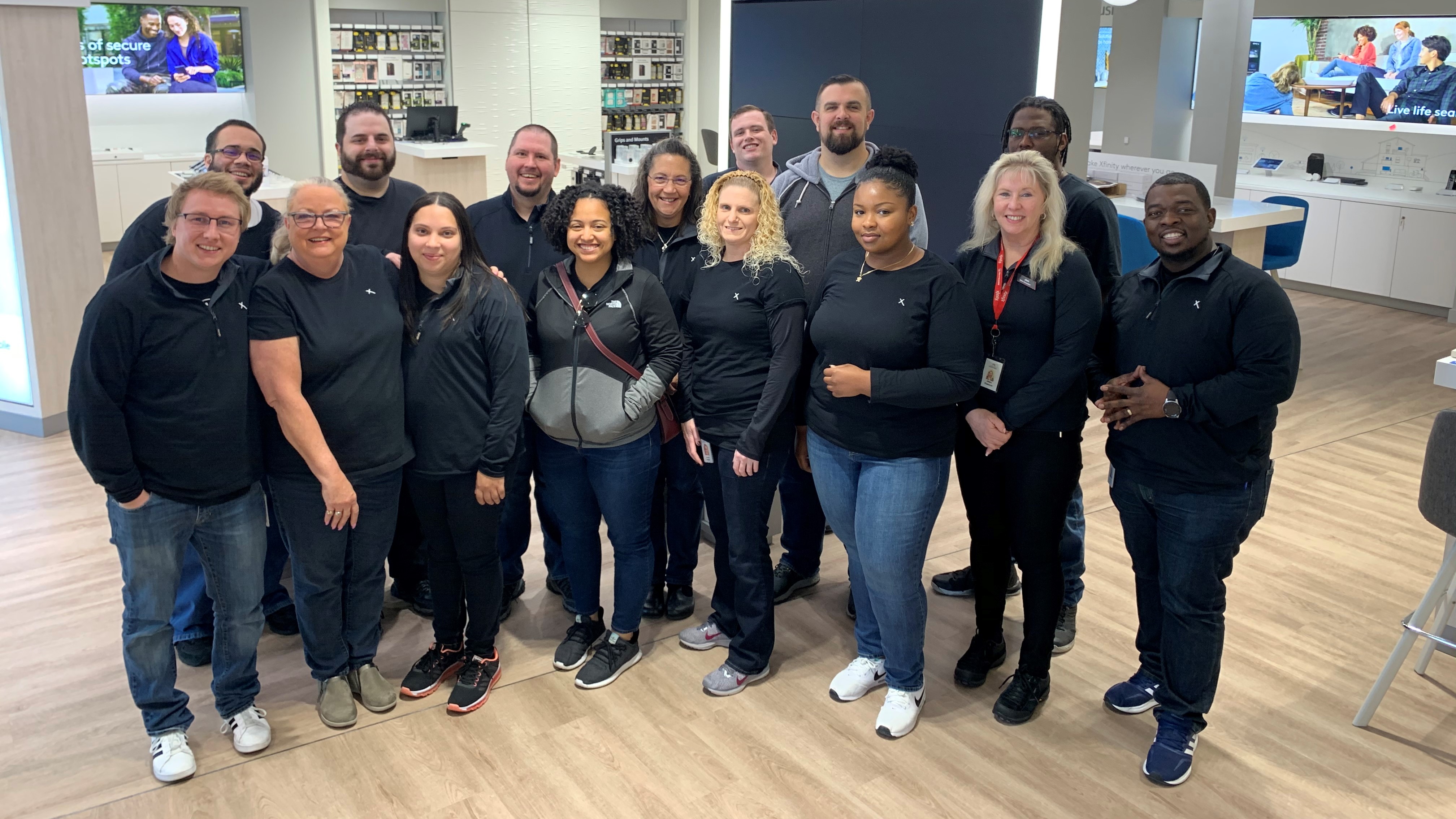 group of Comast employees inside new Lancaster Xfinity Store
