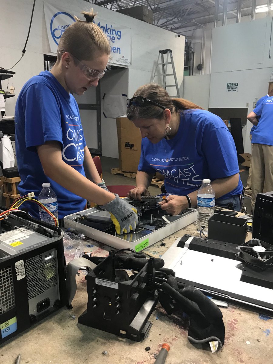Volunteers working on electronics