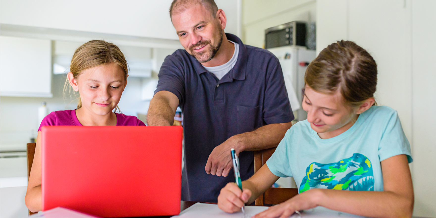 Parent helping children with their homework.